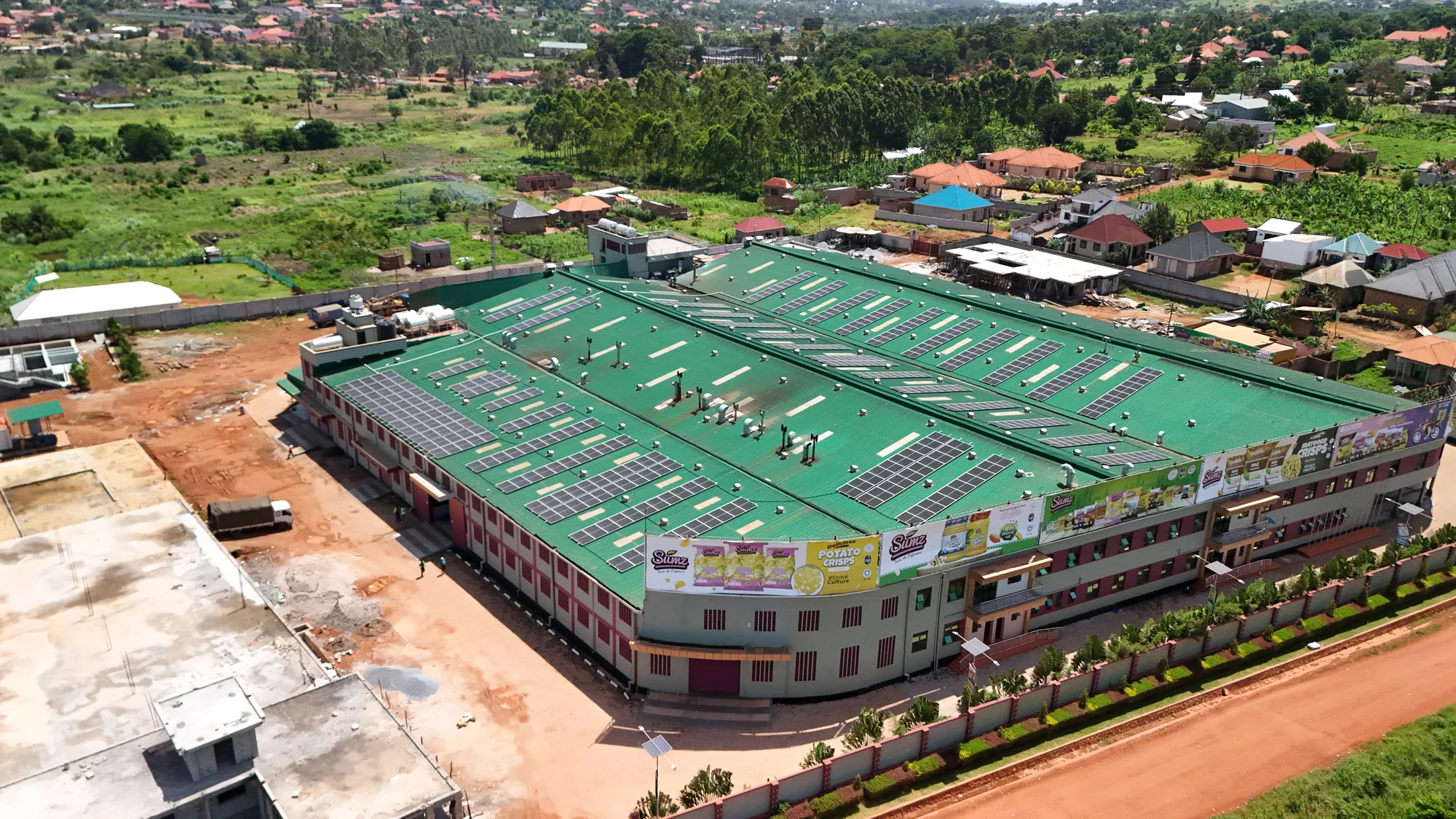 Aerial view of a large rooftop solar power system installed by Equator Solar at a food processing facility in Uganda